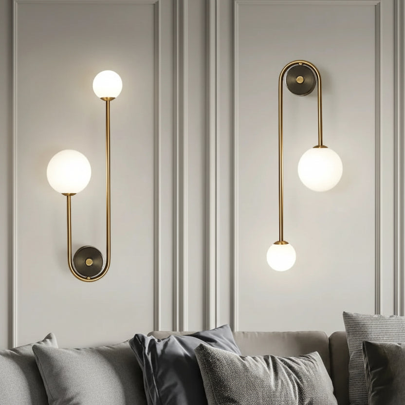 Two modern wall lights with gold fixtures and white globe bulbs on a gray wall, with 'AumgTaiy' branding and product details.